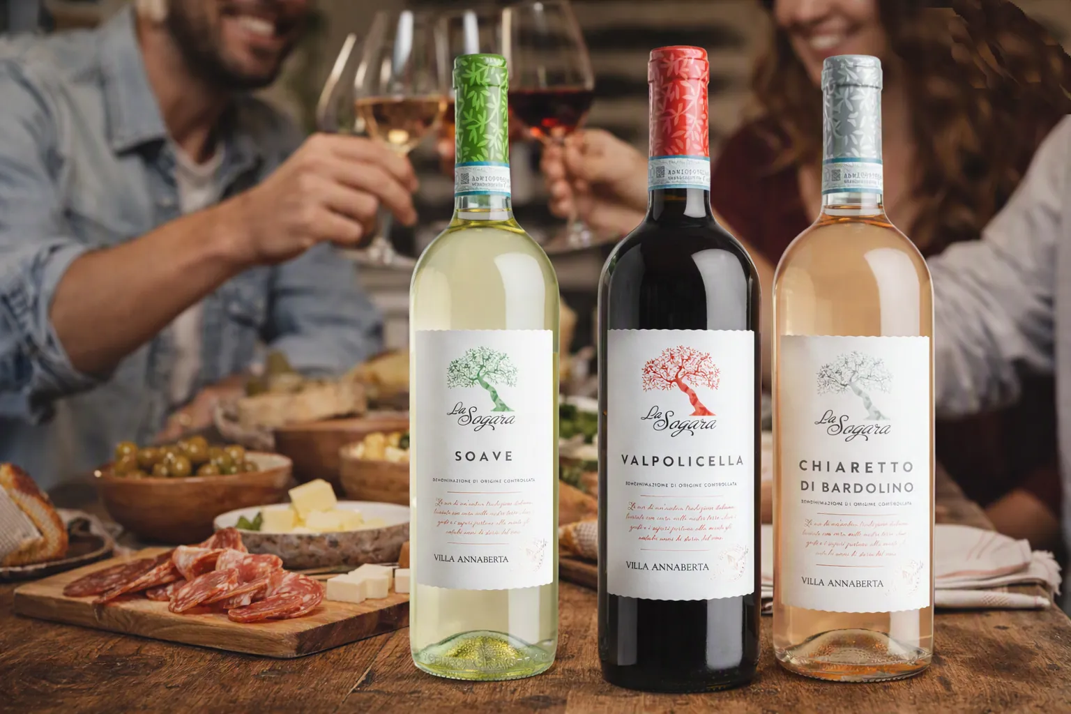 La Sogara Soave, Valpolicella and Chiaretto di Bardolino on a laden table, with friends raising a toast